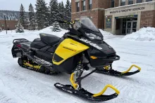 Ski-Doo snowmobile in the snow outside the Michigan Tech campus in Houghton, Michigan